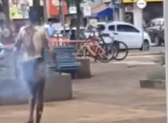 A man sets fire to himself and walks out in the middle of the square in Brazil.