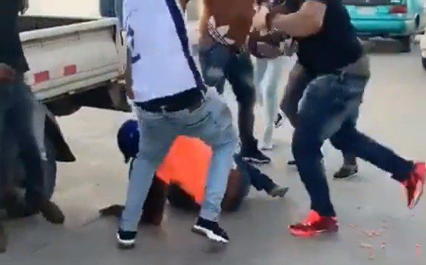 Furious mob beating up alleged thief.