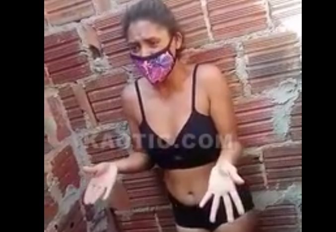 Woman being punished for stealing in the favela in Brazil.