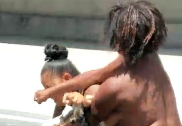 Naked and disturbed woman assaulting elderly woman in the middle of the street in Brazil – Part 1.