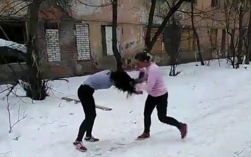 Women’s fight ends with several kicks in the face.