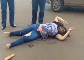Woman throws herself under the wheels of a truck in a terrible suicide attempt.