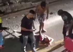 Man being brutally beaten by angry mob in Brazil. I do not know the reason.