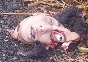 The head of a dead man is found on the side of a street in Brazil.