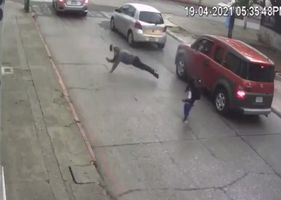 Thief tries to steal car, gets shot and falls like hard feces on the floor.