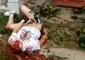 Decapitated body thrown in the middle of the street in China.
