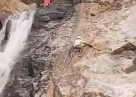 Human spider falling off the cliff.