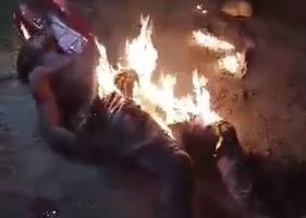 Man being burned alive after allegedly shooting a motorcyclist and trying to steal his motorcycle in Nigeria.