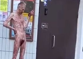 Man with his little toy cut off, completely undressed and bloodstained, looks like a zombie in the middle of the street somewhere in Russia.