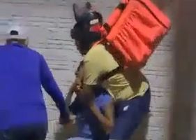 Alleged thief being hard beaten for having robbed motorcycle courier worker in Brazil.
