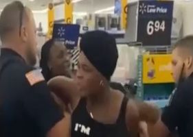 Black woman tries to bite police officer at Walmart and she gets punched in the face.