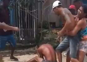 Man being beaten and almost lynched to death in Brazil.