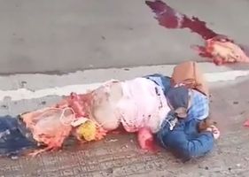 Motorcyclist crushed by truck is thrown on the ground while popular film his misfortune.