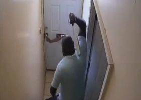 Thief suffers immediate punishment for trying to open a door to steal.