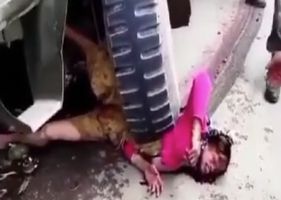 Woman crushed by wheel of military truck.