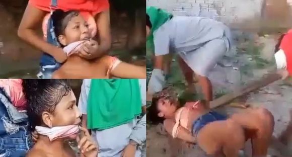 Girl being beaten mercilessly for being caught allegedly stealing in the Brazil slum Photo 0001 Video Thumb