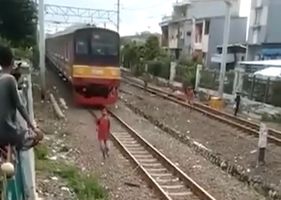 Boy is knocked out by speeding train.