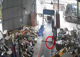 A female worker has her hand sucked into a treadmill in an accident at work in China.