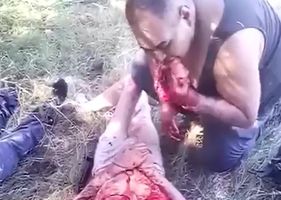 Cannibalism in Mexico! Man filmed eating dead body parts of rival Cartel member.