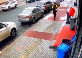 Pedestrian is hit by a giant block of ice that has fallen from the sky somewhere in China.