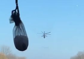 Russian military helicopter attacking Ukrainian military convoy on the road in Russia VS Ukraine war.