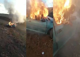 A burning alive woman is rescued from a burning car by pedestrians after a serious accident in Brazil.