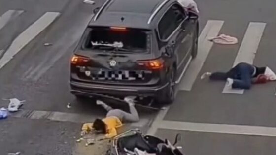 Sad traffic accident in china leaves motorcyclists almost dead on the asphalt Photo 0001 Video Thumb