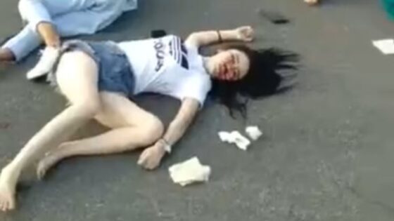 Girl tragically killed in a traffic accident in china is lying on the ground waiting for help Photo 0001 Video Thumb