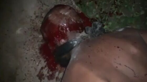 Member of a rival faction being killed with a stone to the head in nigeria Photo 0001 Video Thumb
