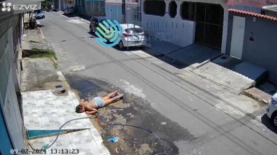 Barefoot woman washing sidewalk slips hits her head and faints in brazil Photo 0001 Video Thumb
