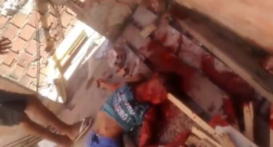 Faction members brutally execute a member of a rival faction in a favela in brazil with beatings Photo 0001 Video Thumb